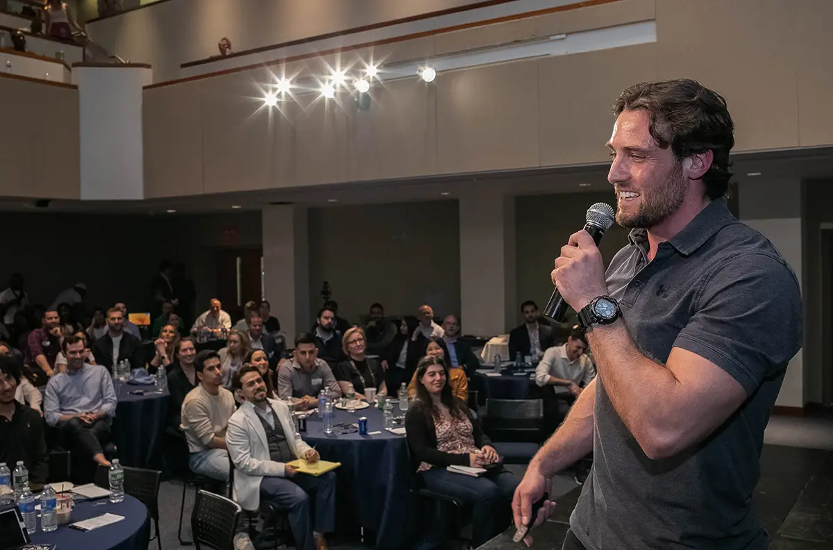 Rob Tracz speaking on stage at A2B Conference motivating entrepreneurs